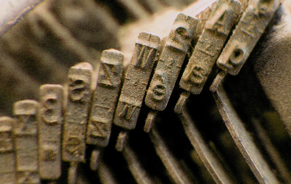 Typebars of a Lettera 32 typewriter. Photo by delcaldo (FreeImages.com).